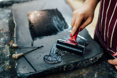 linocut. rolling paint on a pieceの写真素材