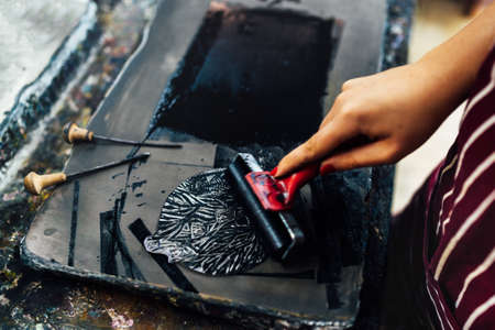 linocut. rolling paint on a pieceの写真素材