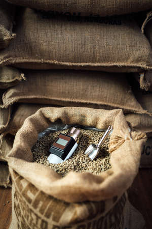 a working device for measuring the humidity of coffee beans in a bag with a metal scoop, in the backgroundの写真素材