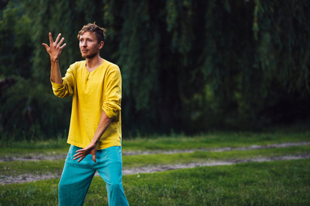 Man doing chan si exercise. Qigong practice in the nature.