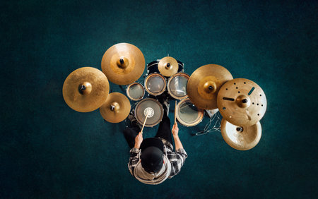 Top view a man playing on a complete full drum kit.の写真素材