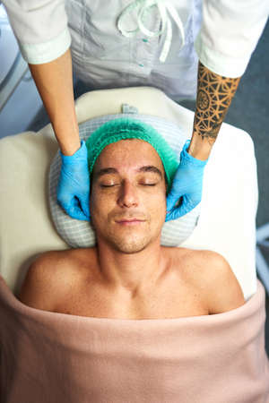 Facial massage at cosmetologists cabinetの写真素材