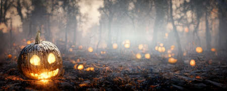 halloween background template burning pumpkin lanterns with cheerful face in forestの写真素材