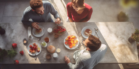 A cozy breakfast family gathering in morning light.の素材