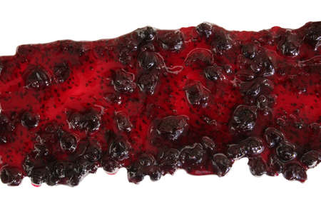 Track of  bilberry jam isolated on white background. Splashes and spilled whortleberry sauce. Blots of blaeberry jam dipped in sauce. isolated on white background. flat lay top view blueberryの写真素材