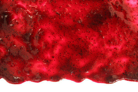 Track of  raspberry jam isolated on white background. Splashes and spilled blackberry sauce. Blots of bramble jam dipped in sauce. isolated on white background. flat lay top view.の写真素材