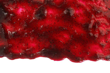 Track of  raspberry jam isolated on white background. Splashes and spilled blackberry sauce. Blots of bramble jam dipped in sauce. isolated on white background. flat lay top view.の写真素材