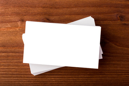 Blank business cards on wooden background. Mockup for branding identity for designers 