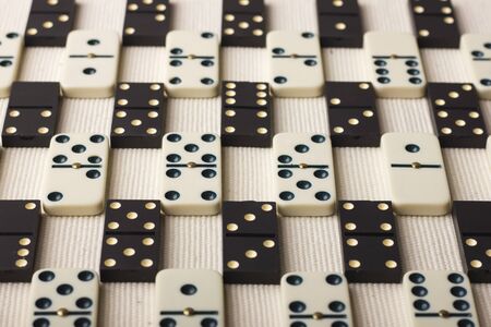 Dominoes are black and white. Light background. The game is tabletopの写真素材