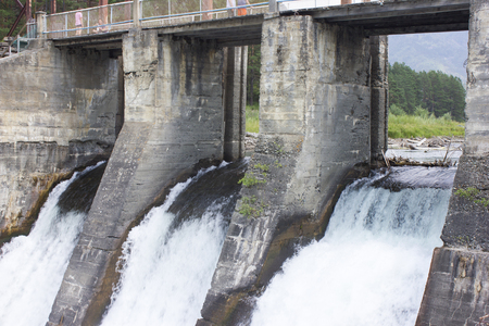 The old hydroelectric station. Russia, Siberia, Altai, Chamal. discharge of waterの写真素材