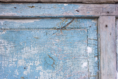 The texture of the old cracked paint is blue. Painted board on many layers の写真素材