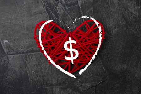 Love of money. A dollar sign on a red heart. Love theme 1の写真素材