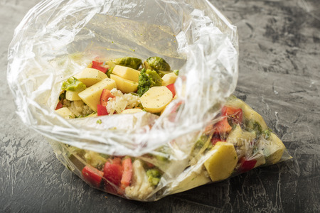 Vegetarian dish. Mixed vegetables in a bag for baking in an oven. A set of vitaminsの写真素材