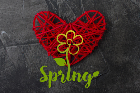 A flower and a red heart with the inscription Spring. Festive greeting card on the theme of spring, love, joy 2の写真素材