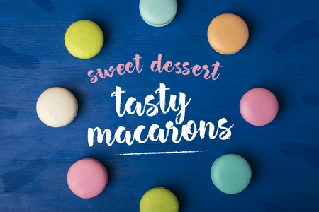 Sweet dessert. Cake macaron or macaroon on a blue background. Copy space 4の写真素材
