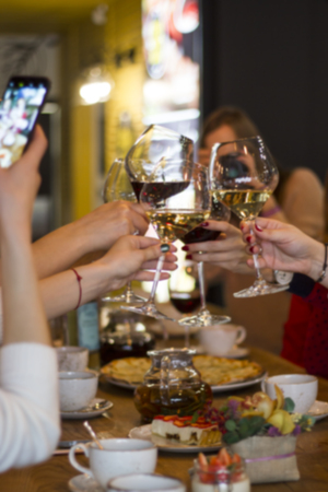 Abstract blur. Glasses of wine on the table in the restaurant. The concept of success. Friends partyの写真素材