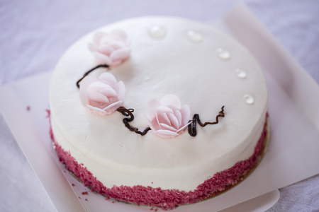 Lovely cream cake with pink roses. Japanese style. Blurred Backgroundの写真素材