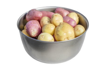 Fresh potatoes in an aluminum bowl on a white background. Isolated objectの写真素材