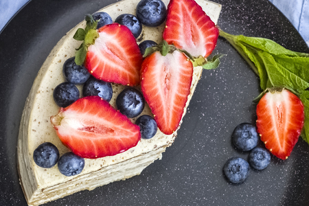 Delicious slices of ripe strawberries decorate the cake. Great dessert. View from aboveの写真素材