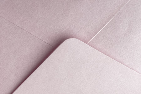 Abstract background in pink color. Detail envelope close up. Copy spaceの写真素材