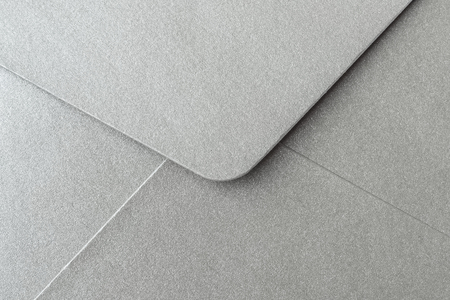 Abstract background in silver color. Detail envelope close up. Copy spaceの写真素材