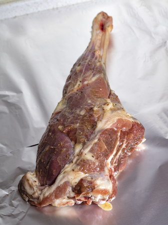raw leg of young lamb in spices and honey with mustard. Cooking Caucasian food. Tasty foodの写真素材