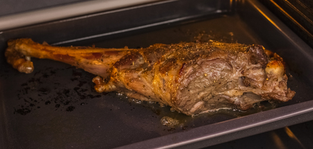 Roast leg of a young lamb in a spirit cabinet. Cooking Caucasian Foodの写真素材