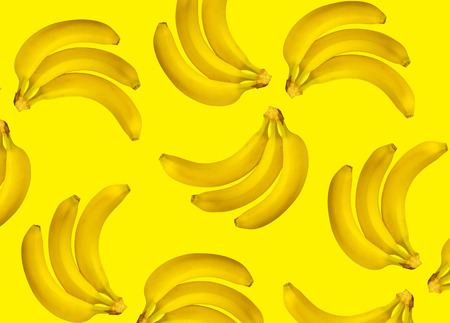 Colorful pattern of ripe bananas. yellow backgroundの写真素材