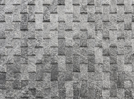 surface of the wall is textured stone. Artificial material for wall decoration in the interior, the surface of buildings. Background, textureの写真素材
