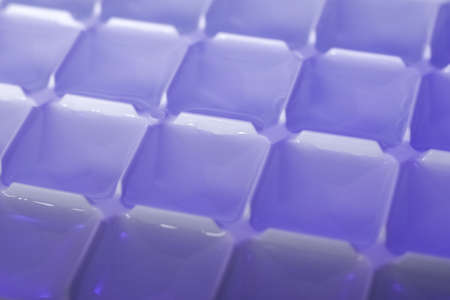 Form for making ice cubes with water. Cold drinks concept. Background, textureの写真素材