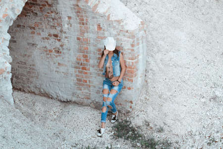 photos of girls in denim clothing. Nude breastの写真素材