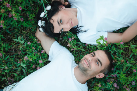 the guy with the girl lying on the grass. photo from the top