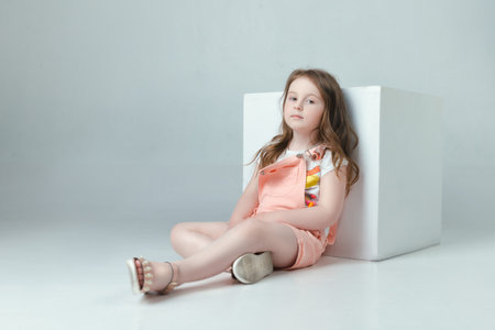 child in the Studio posing in fashionable clothesの写真素材