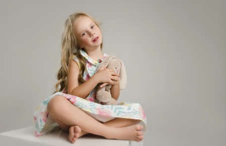 child in the Studio posing in fashionable clothesの写真素材