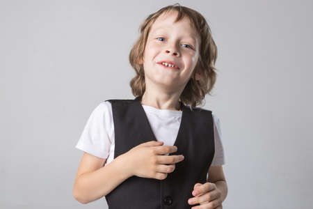 child emotionally posing on camera in the Studio on a white backgroundの写真素材