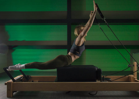 woman is engaged in Pilates. fitness and sports