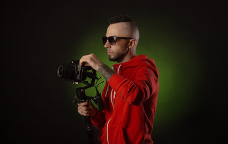 the guy with the stabilizer and a dslr camera shoots video