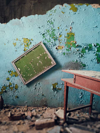 old plaque on the wall in an abandoned factory . cracked paint textureの写真素材