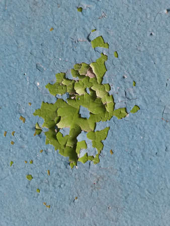 photo of an old painted wall with the texture of cracked paintの写真素材