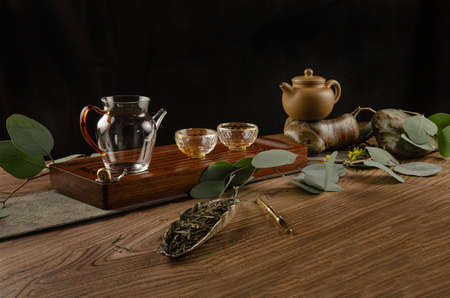 the tea table with instruments teapots cups pancake and tea Shen Puerの写真素材
