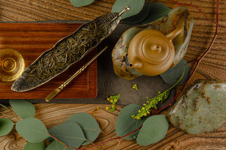 the tea table with instruments teapots cups pancake and tea Shen Puerの写真素材