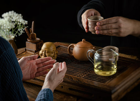 the tea ceremony hand men and women to pour the tea