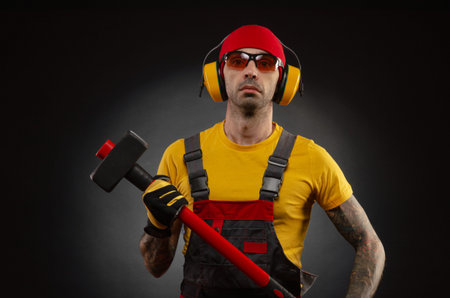 the male construction worker with a sledgehammer