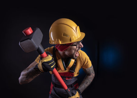 male construction worker with a sledgehammer