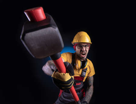 the male construction worker with a sledgehammerの写真素材
