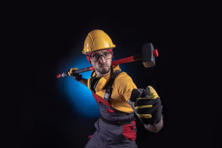 the male construction worker with a sledgehammer
