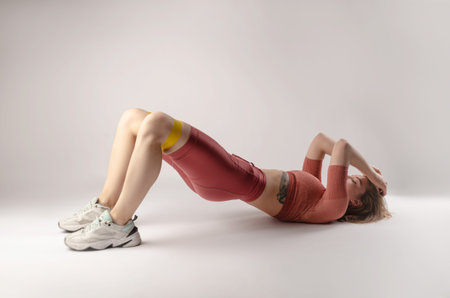 athletic girl posing in the Studio on a white background