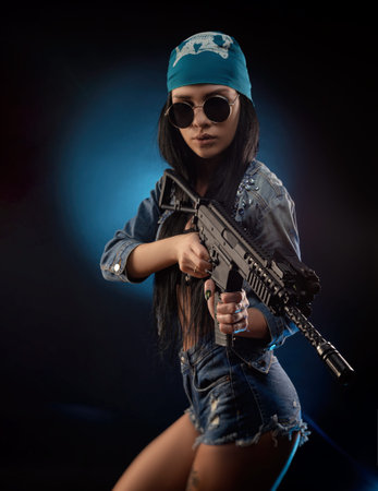 a girl in a DENIM jacket with an AUTOMATIC RIFLE