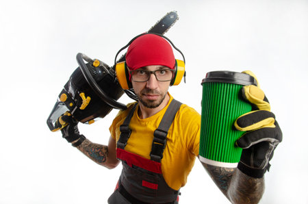 a guy in protective coveralls with a chainsaw on a white background