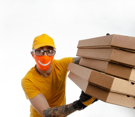 the guy delivering packages in a virus-proof mask, the courier with pizza